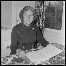 Mrs M. J. s'Jardin with her personal cookery book.