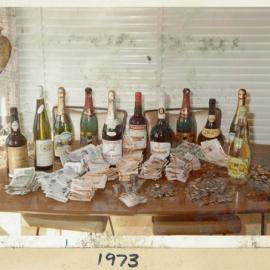 Table with Money and Wine Bottles