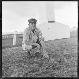 Mr P. A. Waswo inspecting the racecourse's newly sown grass