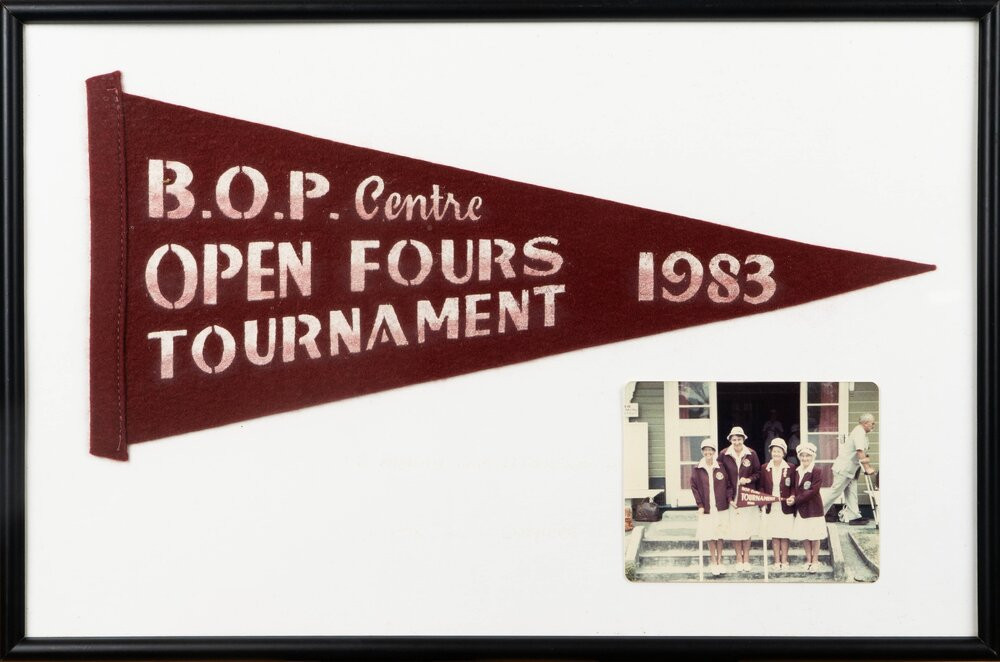 Framed felt flag and colour photograph from the Bay of Plenty (BOP) Centre Open Fours Tournament, 1983.
Te Ao Mārama - Tauranga City Libraries Ams 231/3/1