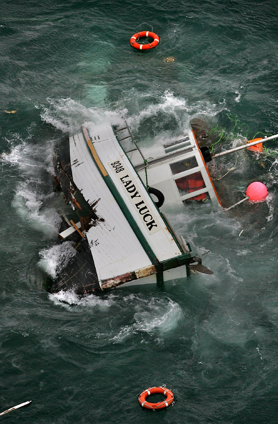 Lady Luck founders on her side. Photographed by John Borren for the Bay of Plenty Times, June 23, 2006.

NZME-CD-356-230606jb01