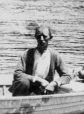 Jack Denniston boating on the Wairoa River, 1920s. Cropped from Photo 03-246.