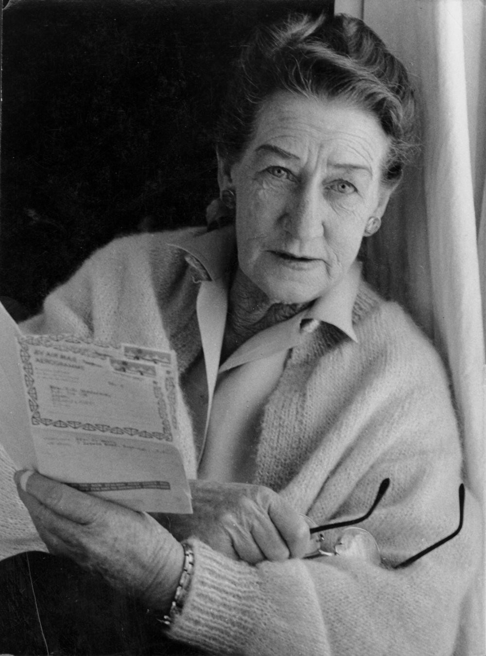 Sylvia Ashton-Warner (Ōtūmoetai) "reading the New Zealand mail". Photo 03-488
