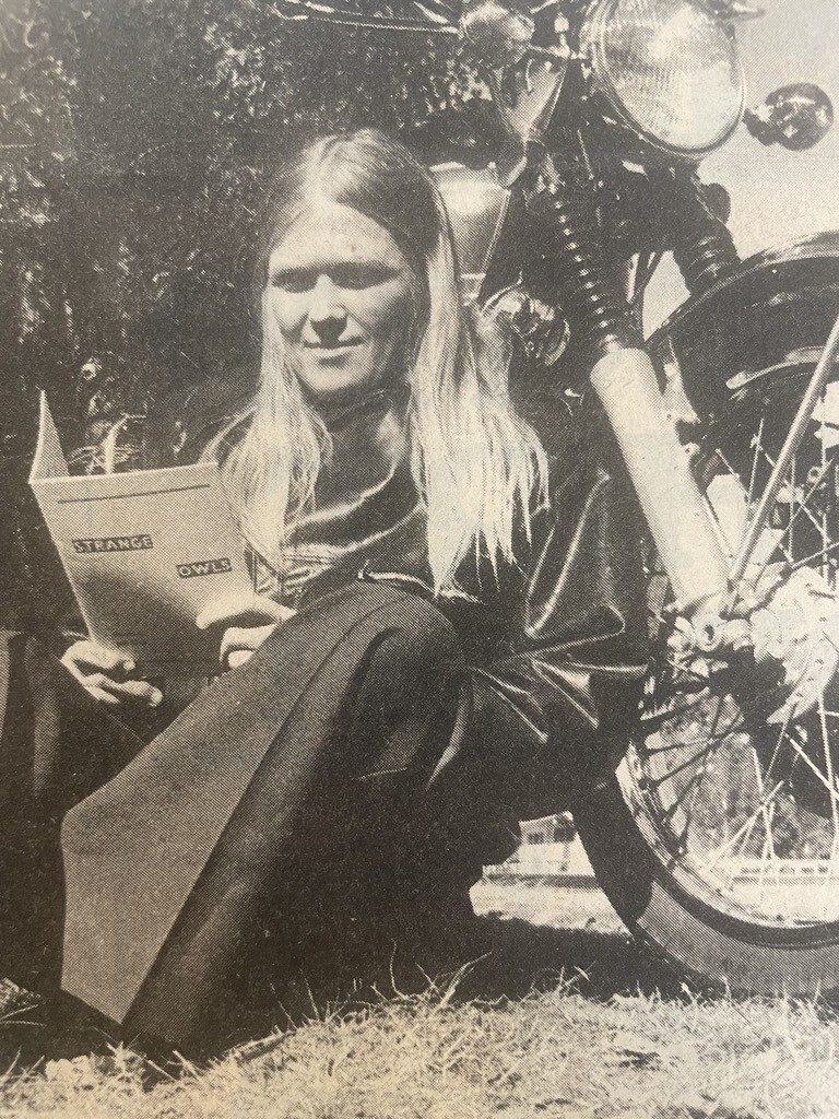Jan FitzGerald sits next to her 750cc motorcycle with her book 'Strange Owls'.  Published in the Bay of Plenty Times, 12 April 1978.